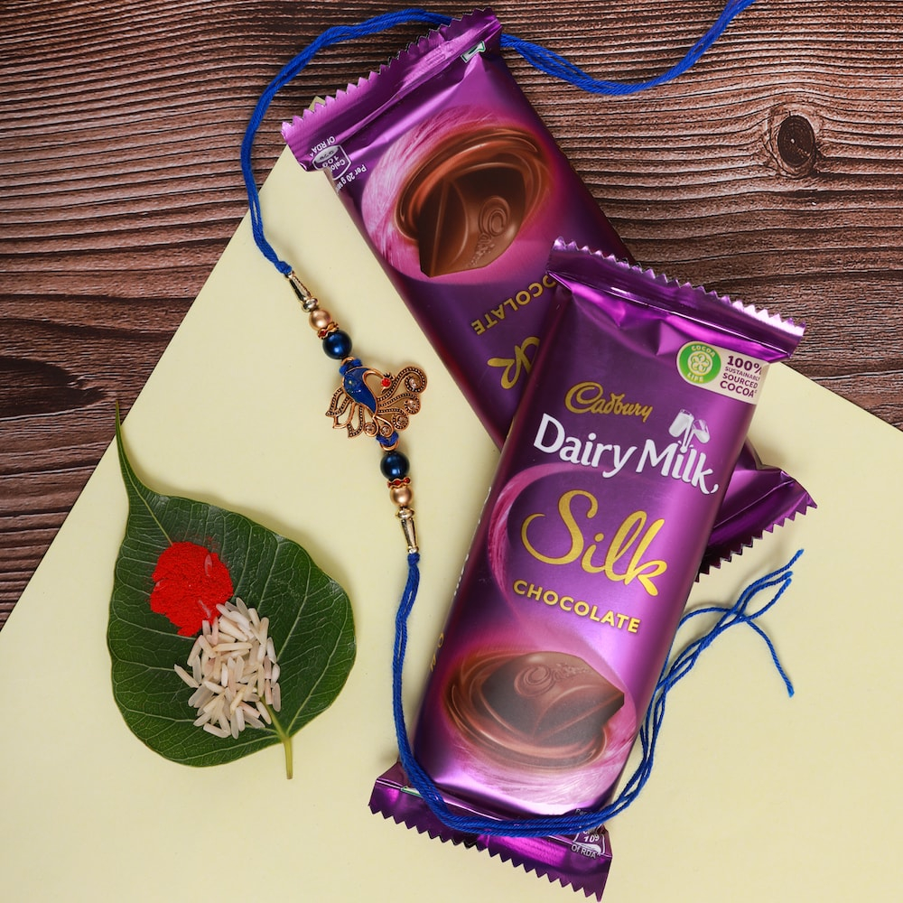  Peacock Rakhi With Silk Hamper