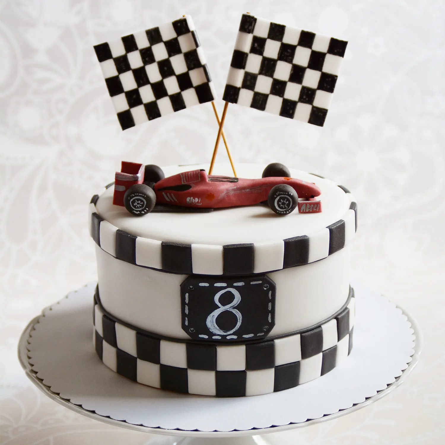 A race track 2 tier, and a J.D 2 tier... - Cakes from Scratch | Facebook